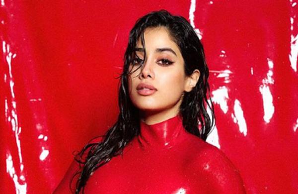 Janhvi Kapoor adds a touch of boldness in red tight dress.